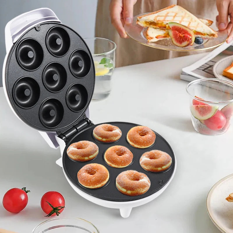 Mini parrilla eléctrica para hacer rosquillas, máquina de pan portátil de 7 orificios y 1200W, aparato de cocina antiadherente, enchufe europeo/estadounidense, 110/220V