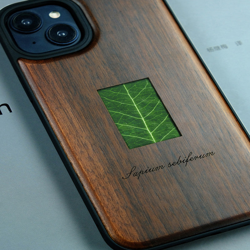 Étui de téléphone en bois massif avec spécimen de plante